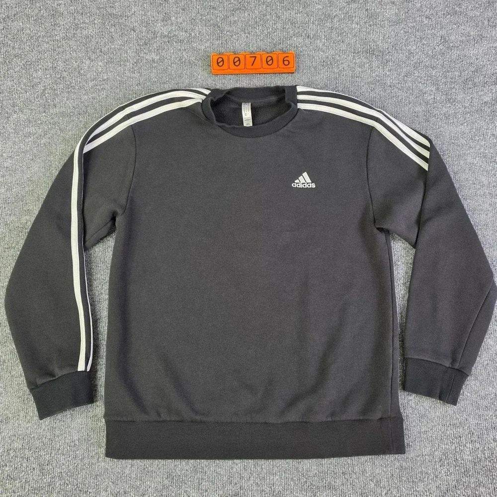 Adidas black crewneck sweatshirt with white stripes on sleeves, size M